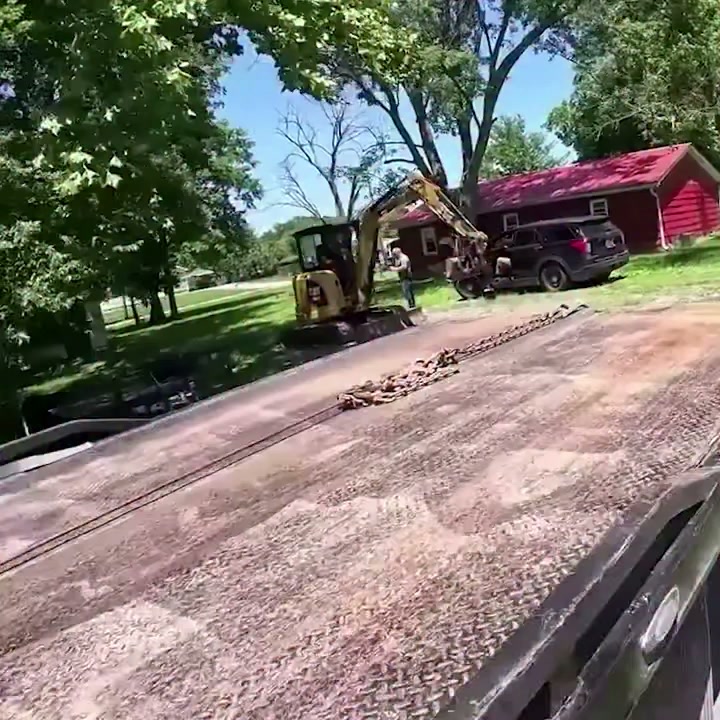 Car against a pole and a stolen excavator