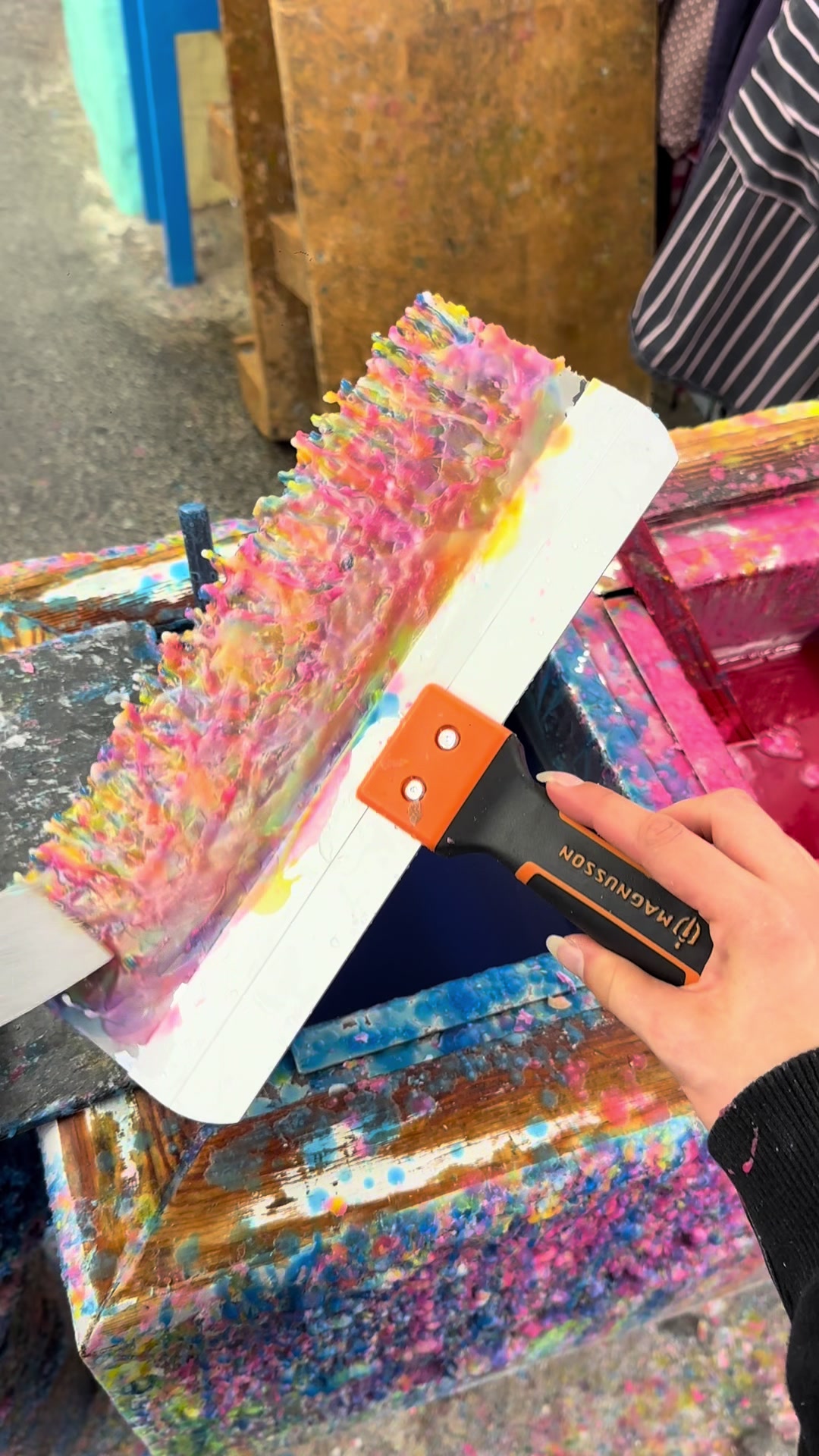 The detailed wax scraping process behind candle art