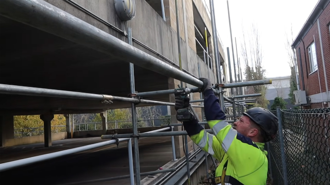 Erecting scaffolding for demolition works and high-rise projects