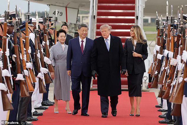 Trump visibly winces during stone-faced Xi's red carpet welcome