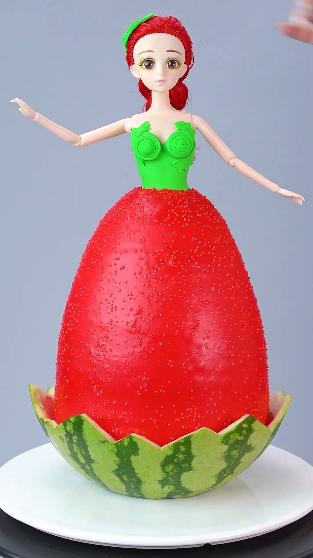 Creative cake decorating transforming a doll into watermelon art