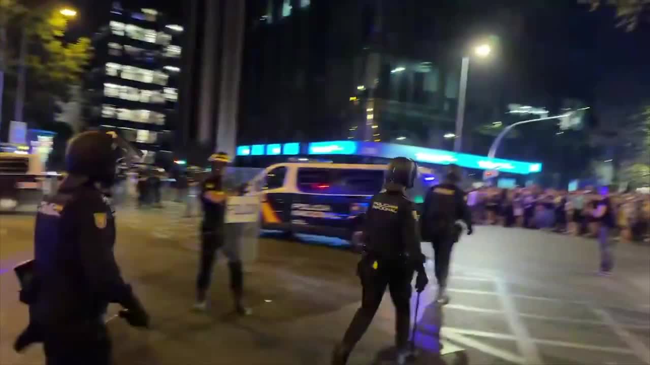 Riot police charge protesters in Madrid after eviction of woman, 87 ...