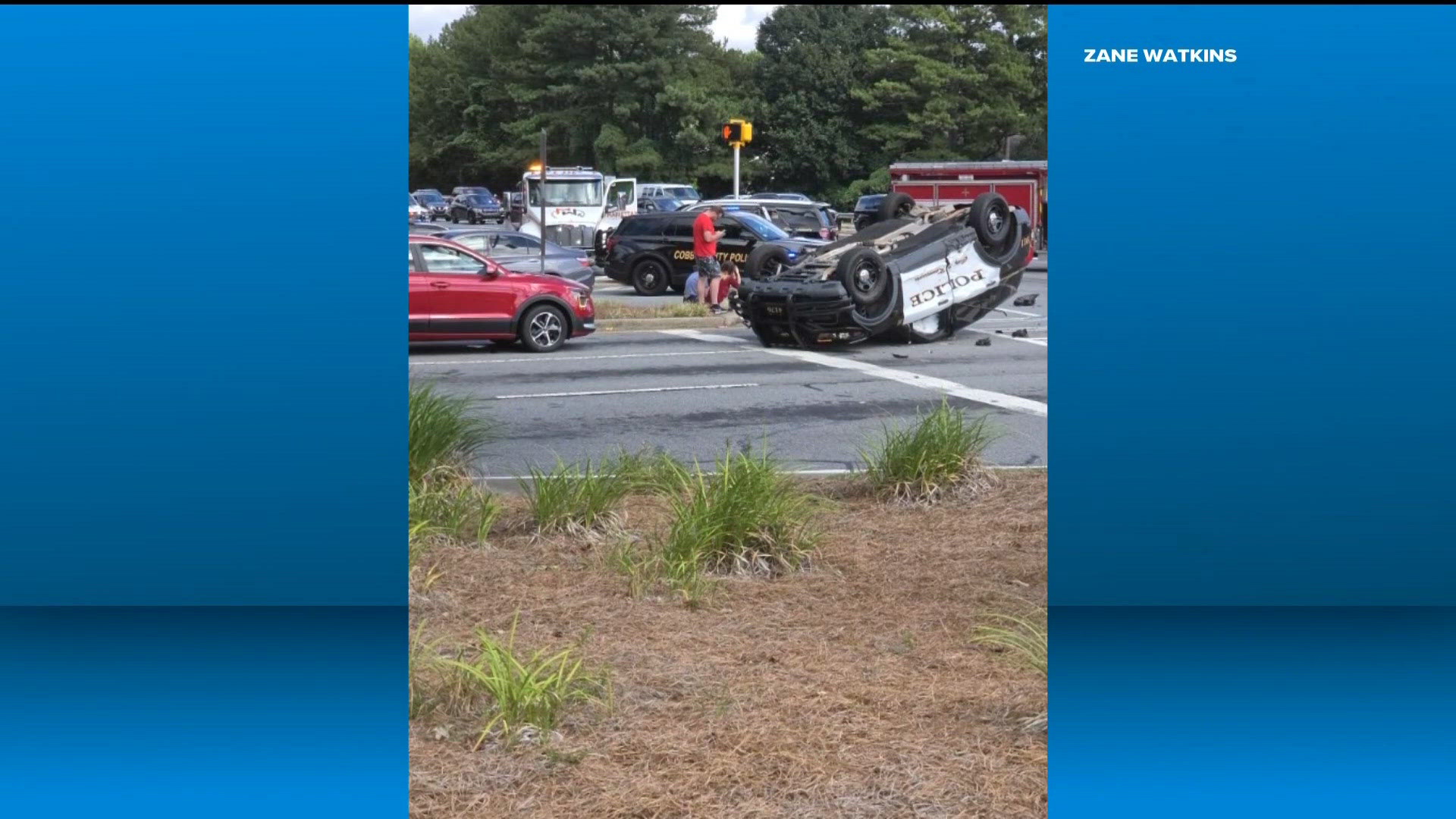 Video shows Kennesaw police car flipped after crash at busy intersection