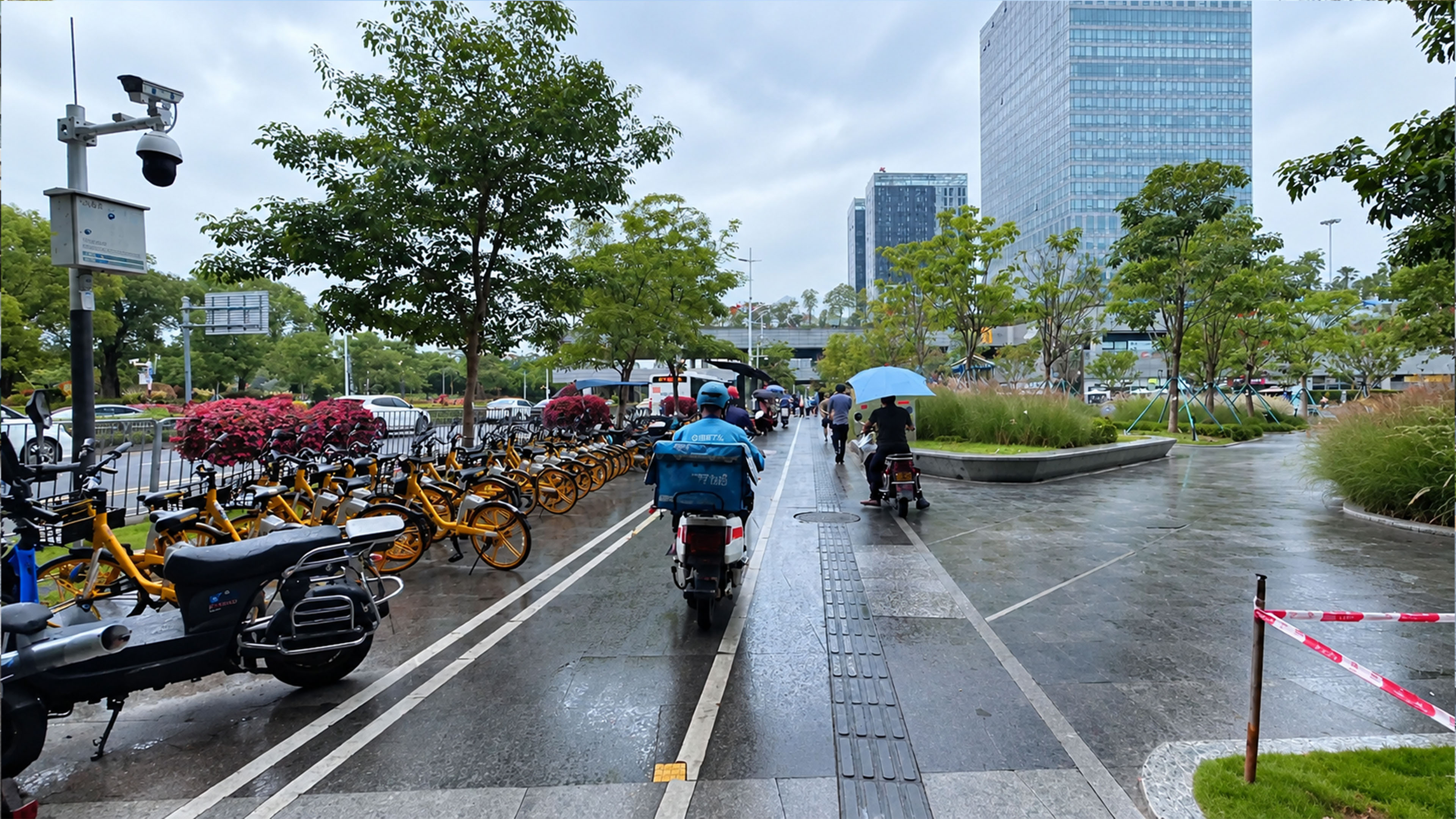 Modern buildings and green public spaces on a rainy day in Longhua