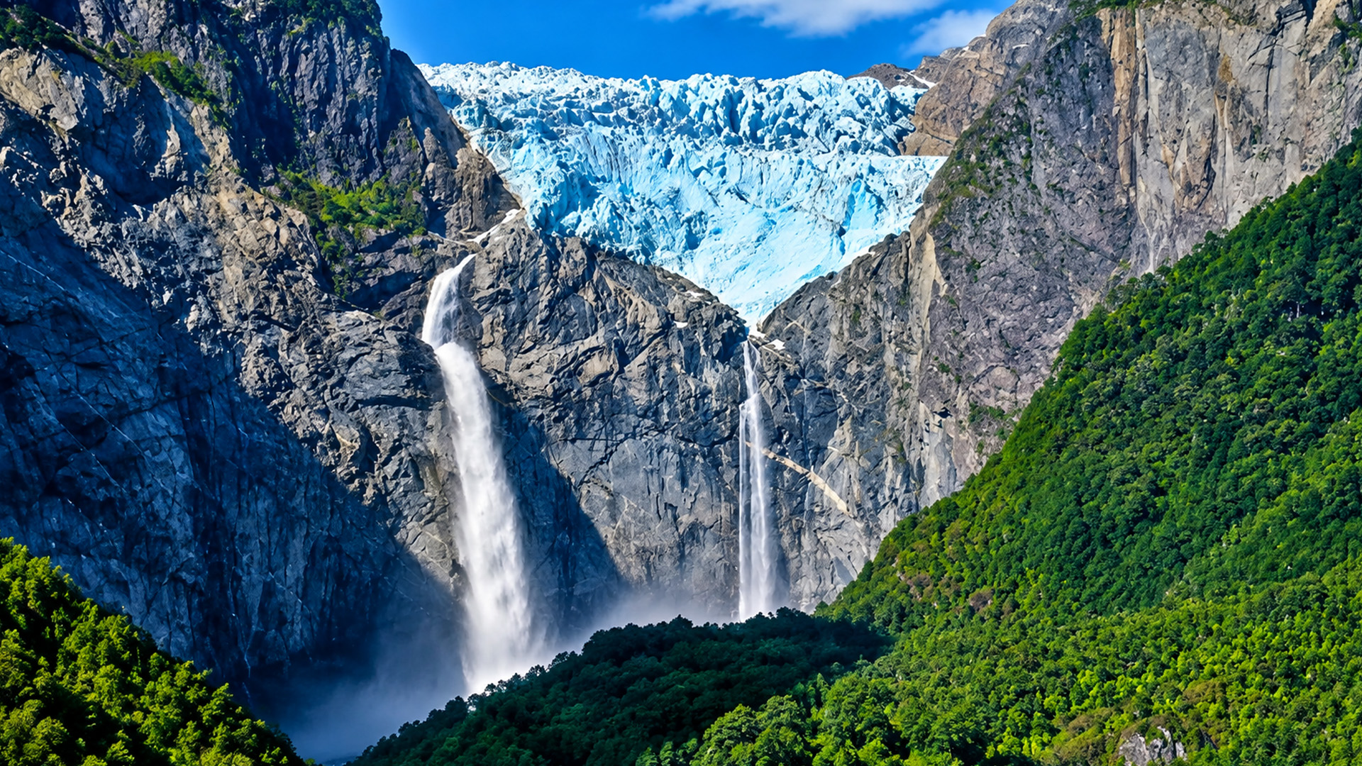 Waterfalls cascading beneath a massive Patagonian glacier
