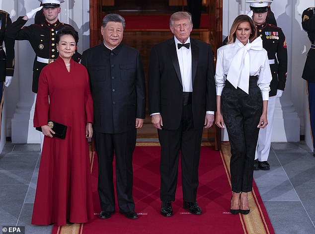 Moment China's President Xi bursts into laughter as Trump shows him ...