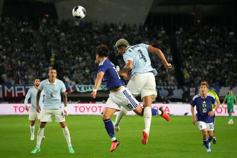 Ronald Araujo of Uruguay and Kuryu Matsuki of Japan com during the international friendly match between Japan and Uruguay at Q&A Stadium Miyagi