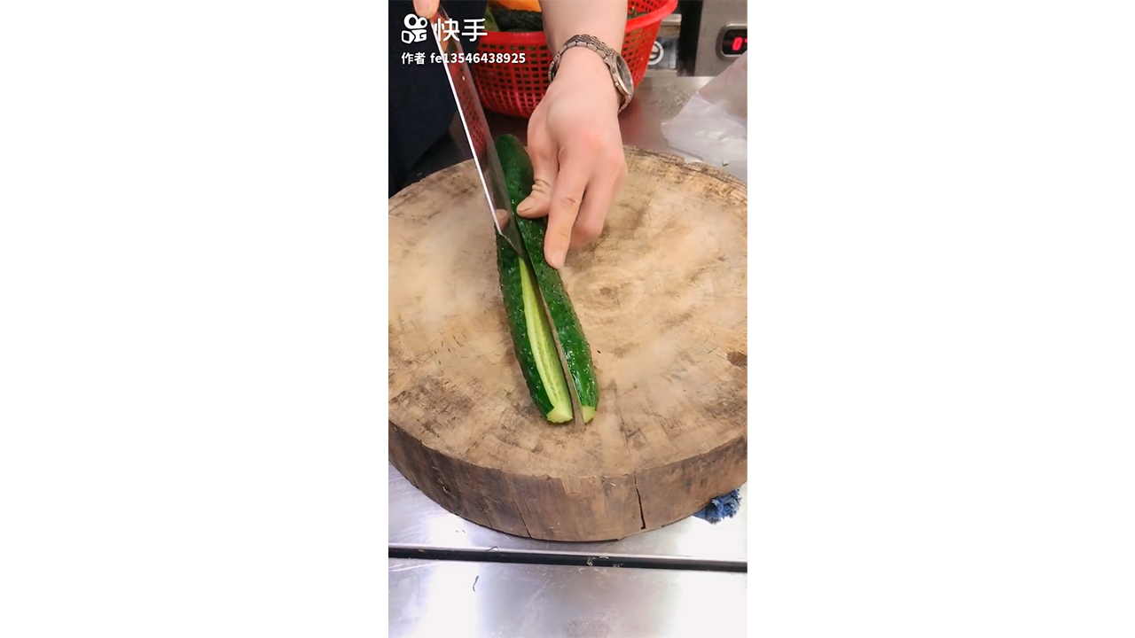 Slicing cucumber lengthwise into thin strips with sharp knife creating ...
