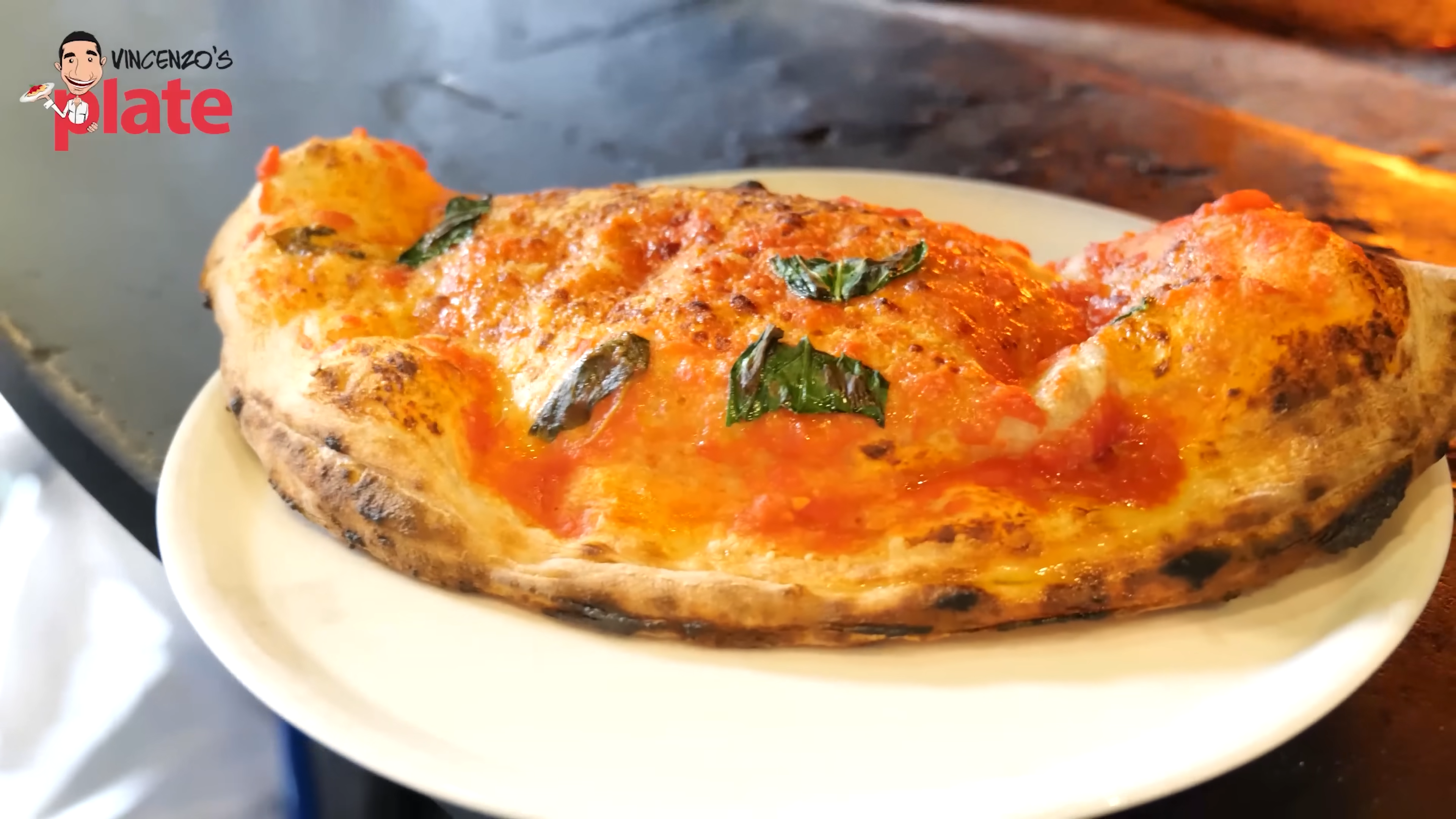 A Naples pizza chef fills this calzone with ricotta and mozzarella ...