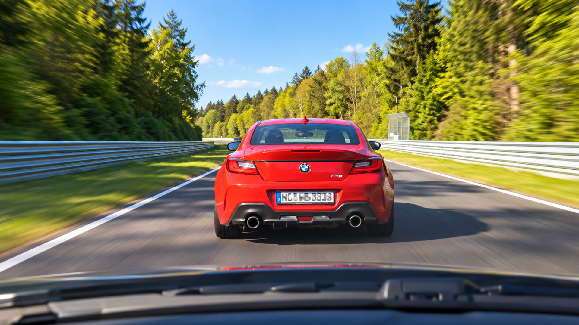 Chasing a red BMW M2 along the Nürburgring straight