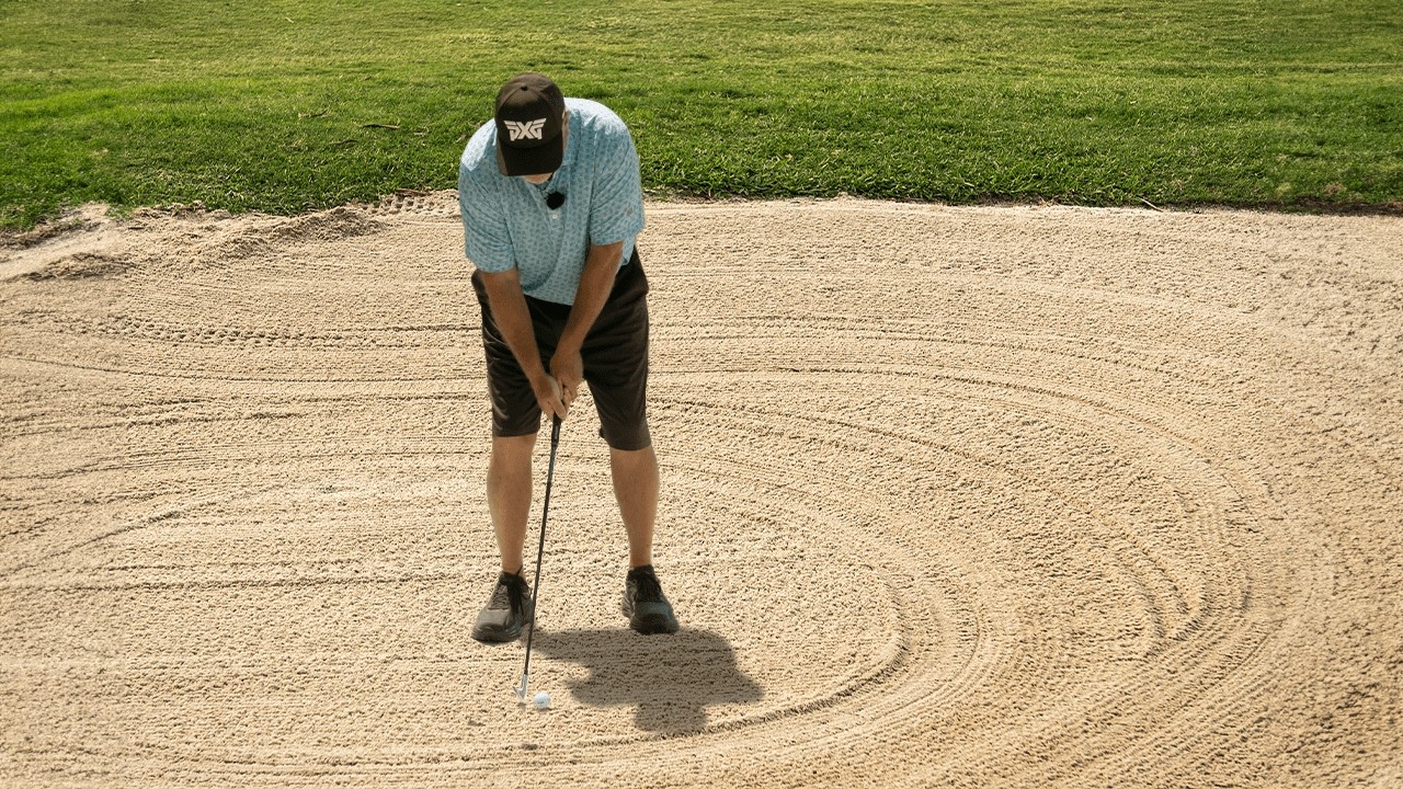 Master the fairway bunker shot: Simple tips for hitting the ball first!