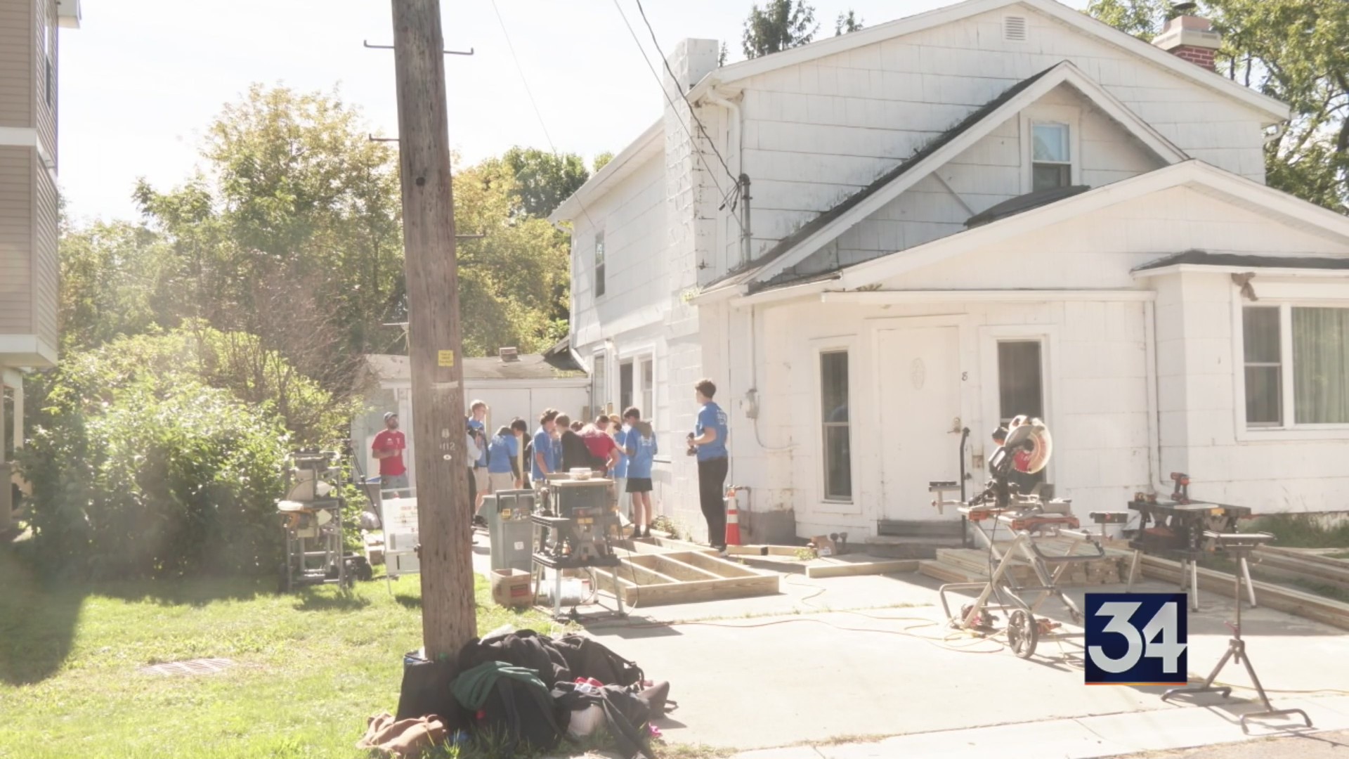 Local high schoolers help build an accessibility ramp