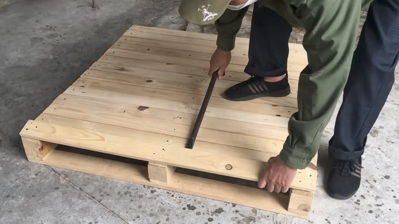 Man turns old wood pallets into an impressive shelving system with a ...