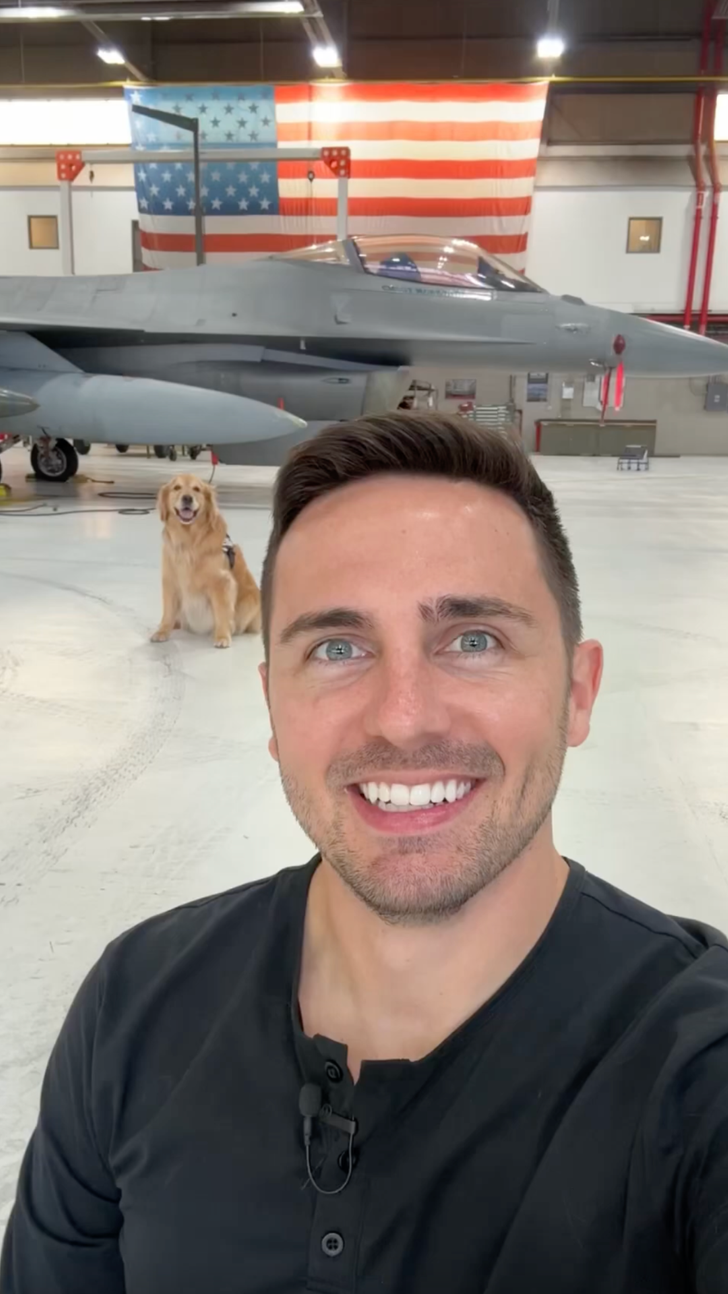 A golden retriever snaps a selfie beside a fighter jet and the result ...
