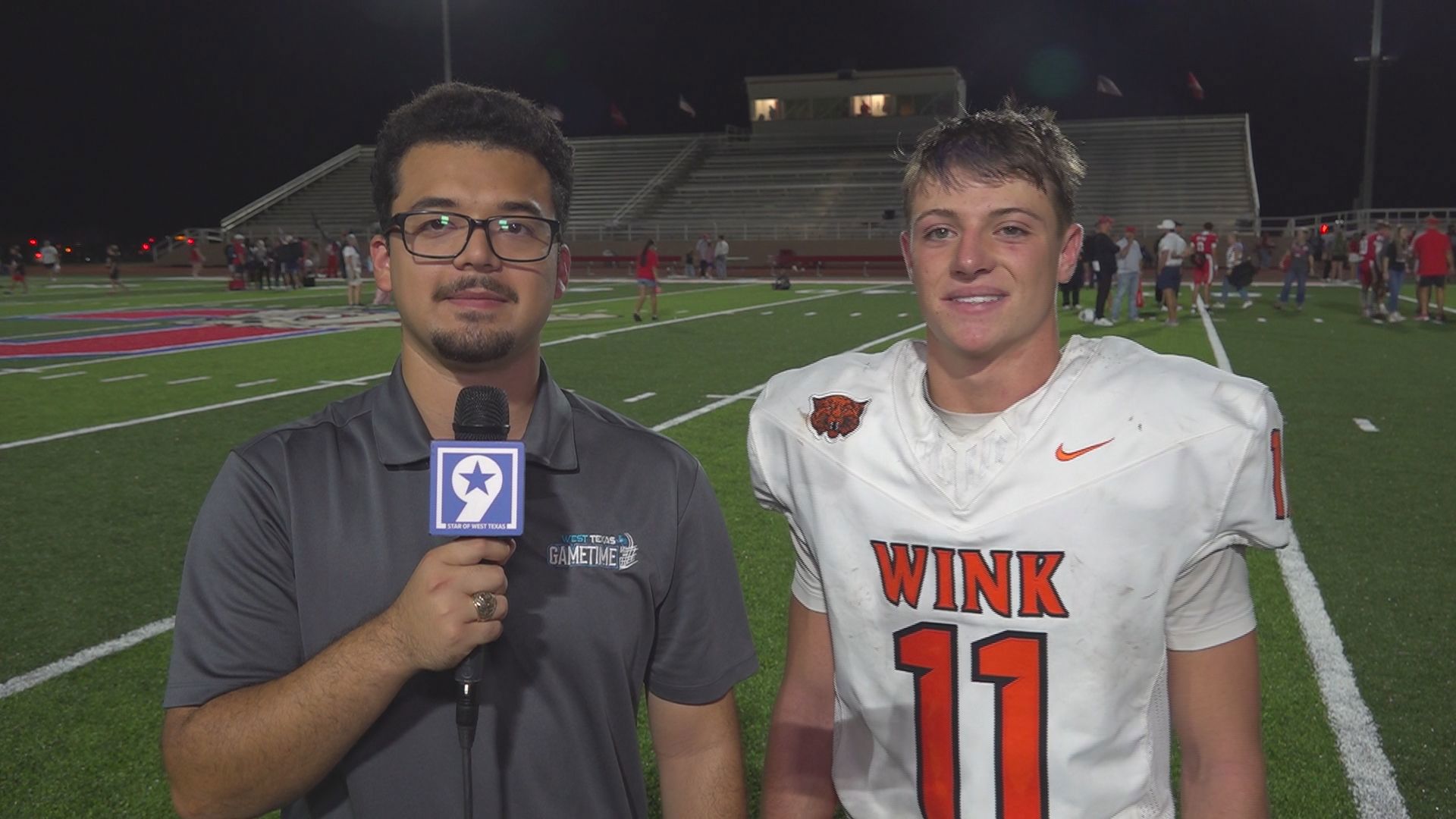 Wink quarterback Layne Lusby and head coach Brian Gibson talk after a ...