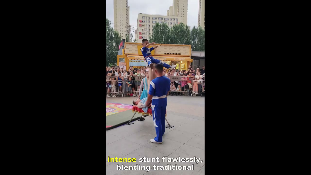 Foot juggling acrobatics with boy balancing in Liaoning, China