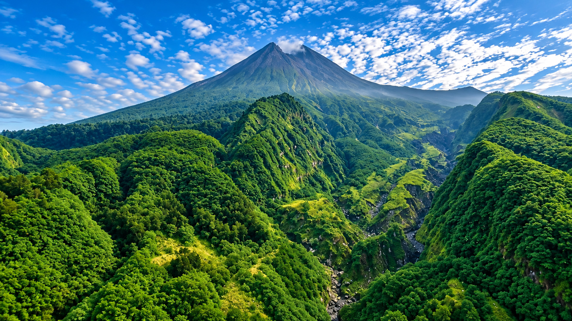 Mount Merapi rising above green farmland