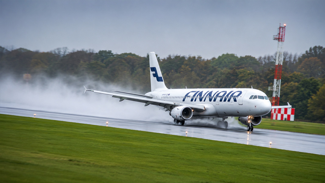A380 powers off wet runway in heavy rain