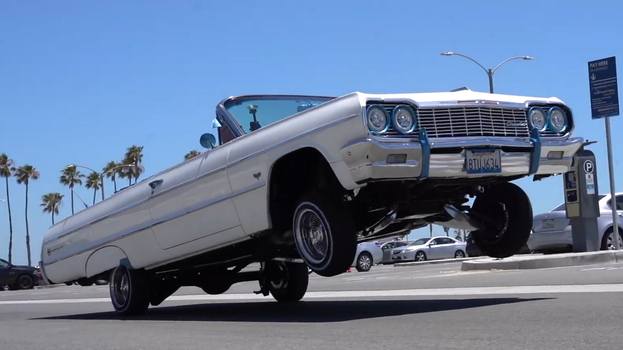 This '64 Impala lowrider hits a standing three wheel!