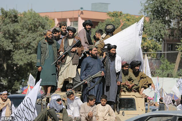 Supporters of Taliban government rally as part of celebrations to mark the fifth anniversary of the Taliban takeover of Afghanistan, in Kabul, Afghanistan, in August