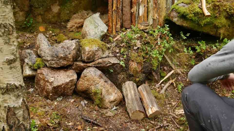 Preparing a campfire during wet weather