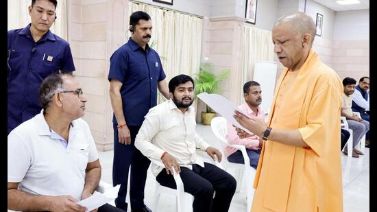 Uttar Pradesh CM Yogi Adityanath listening to people’s issues at Janata Darshan in Lucknow on September 14.