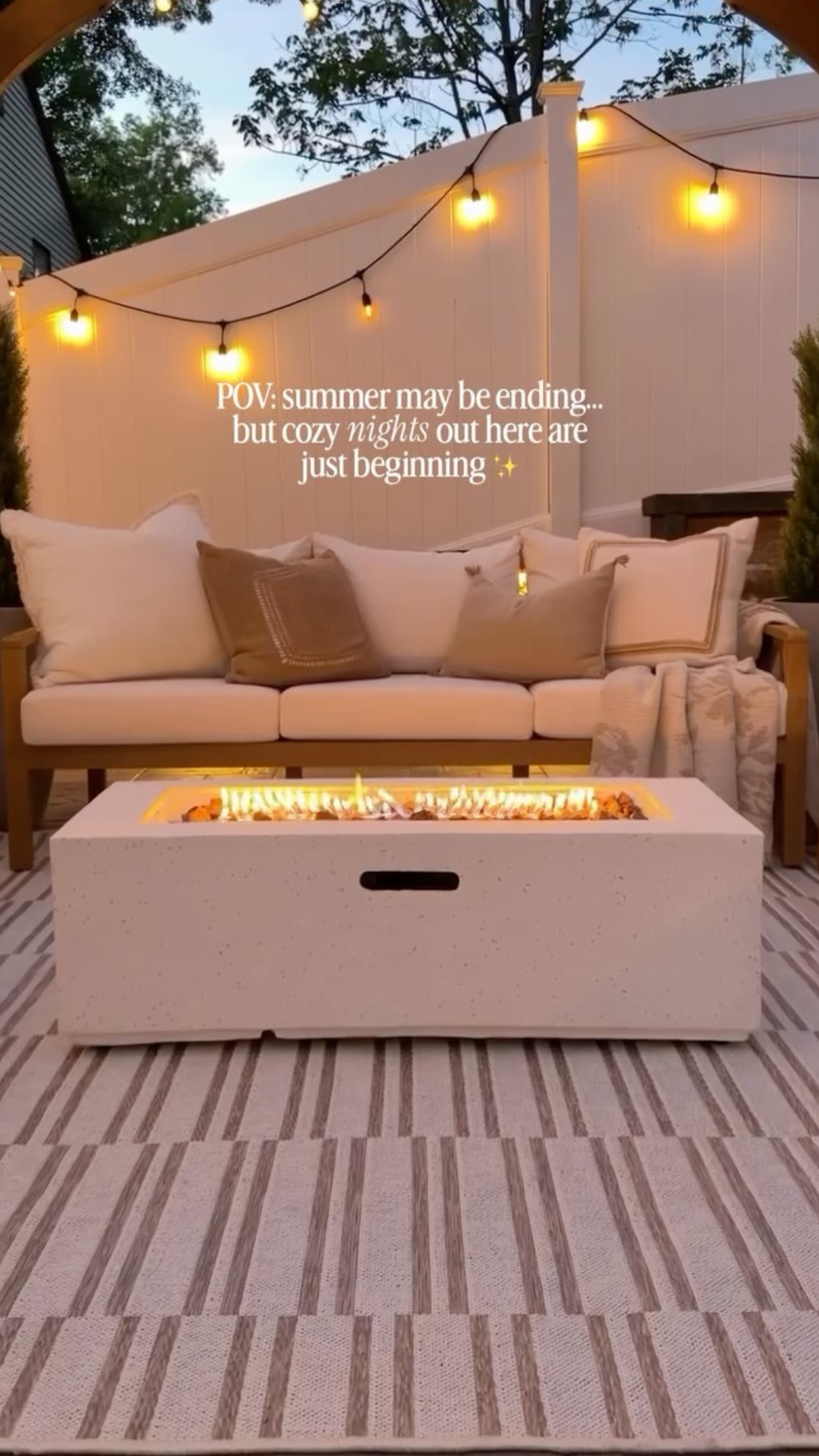 Outdoor fireplace creates a cozy backyard retreat