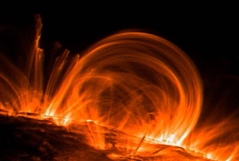 Twin coronal holes aim solar wind at Earth: G1 storm window through Tuesday