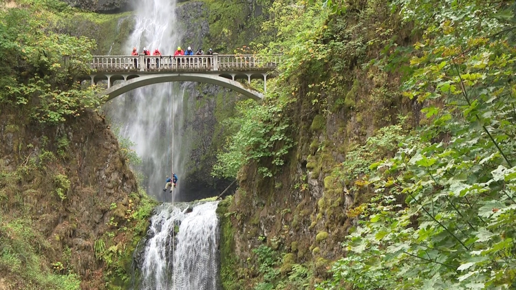 Search and rescue crews rappel into Multnomah Falls to clean up hard-to-reach trash