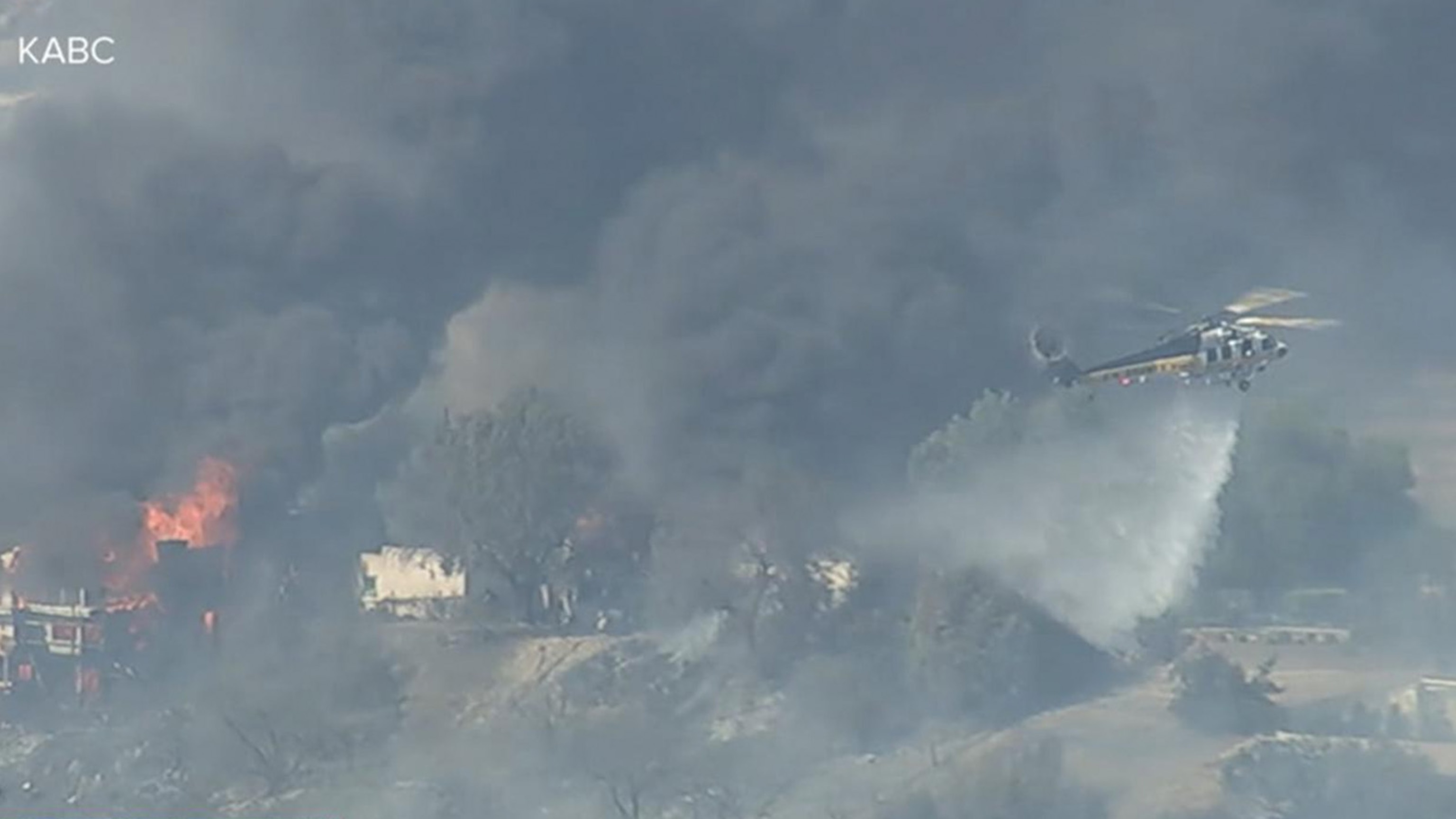Fast-moving brush fire threatens homes in Los Angeles County