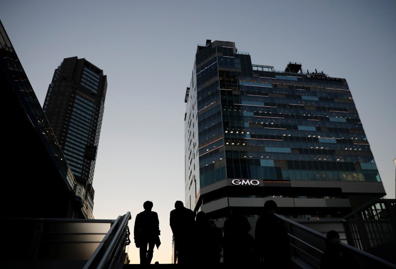 Japan to sidestep funding in tax cut outline, keep fiscal concerns alive