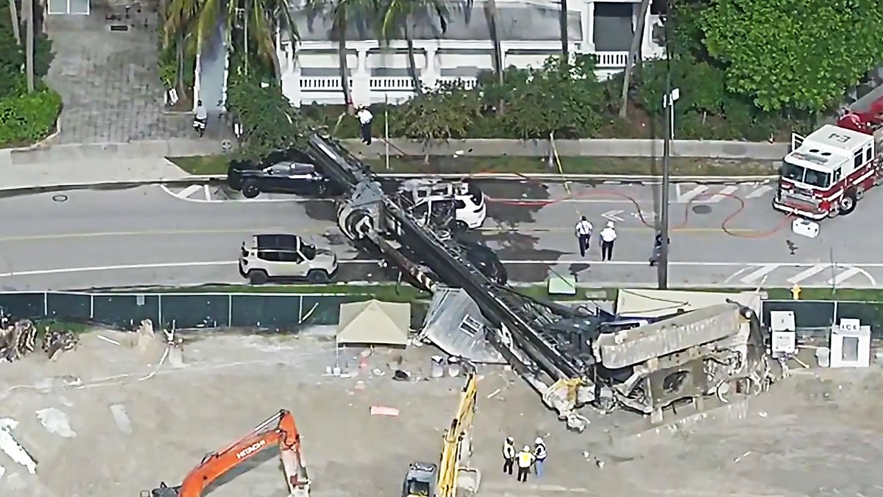 Four injured after 85ft drilling rig collapses onto road in Miami