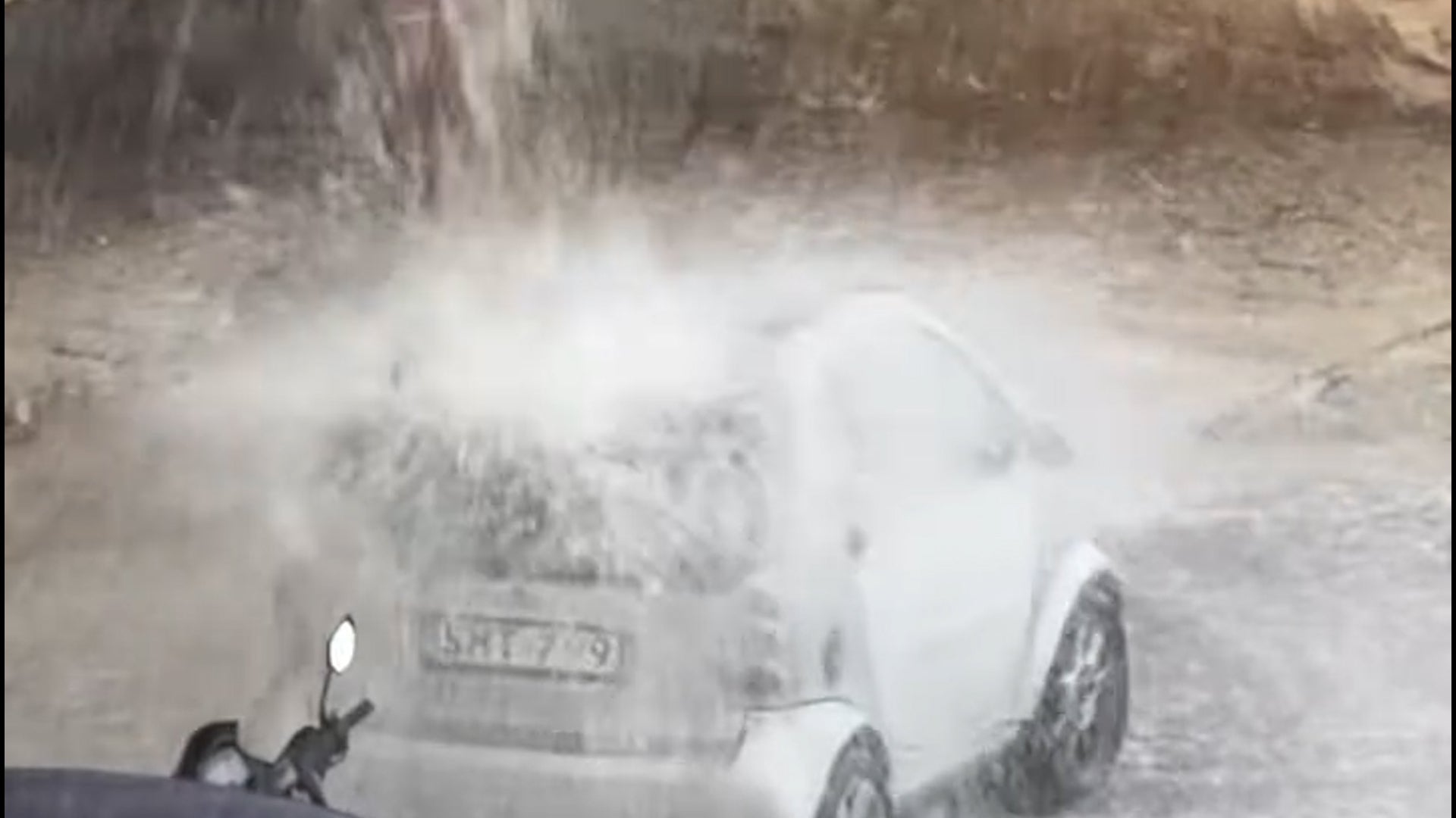 Watch: Car gets absolutely hammered by rain runoff in Malta