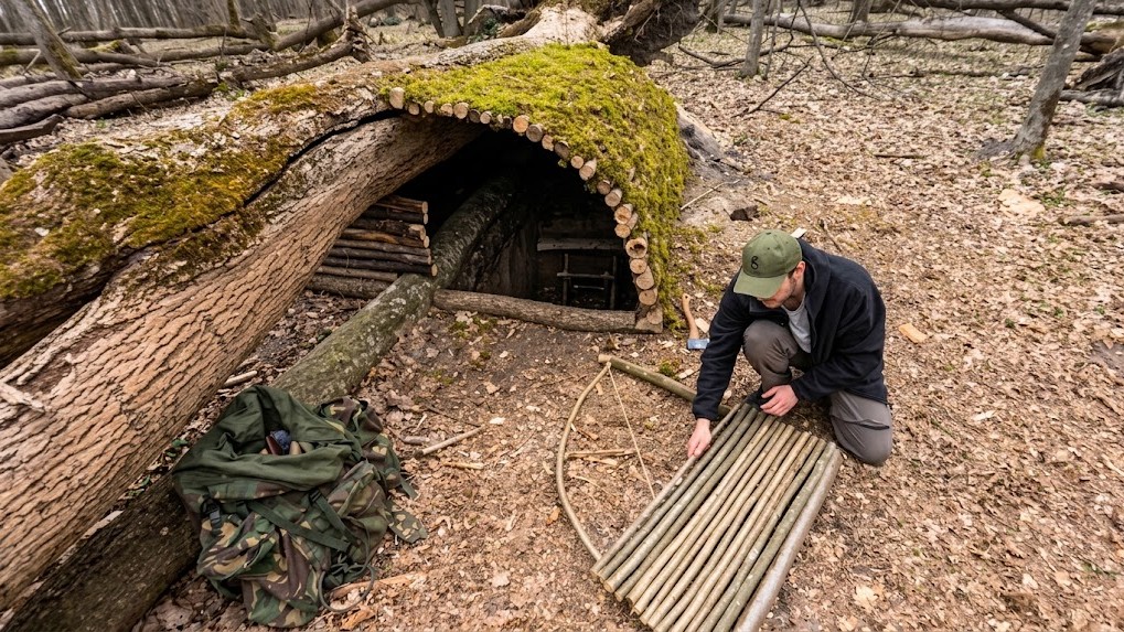 A cozy two-room dugout takes shape deep in the woods