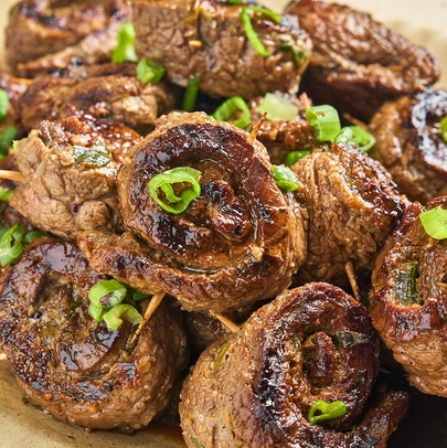 Delicious 90s party steak pinwheels recipe
