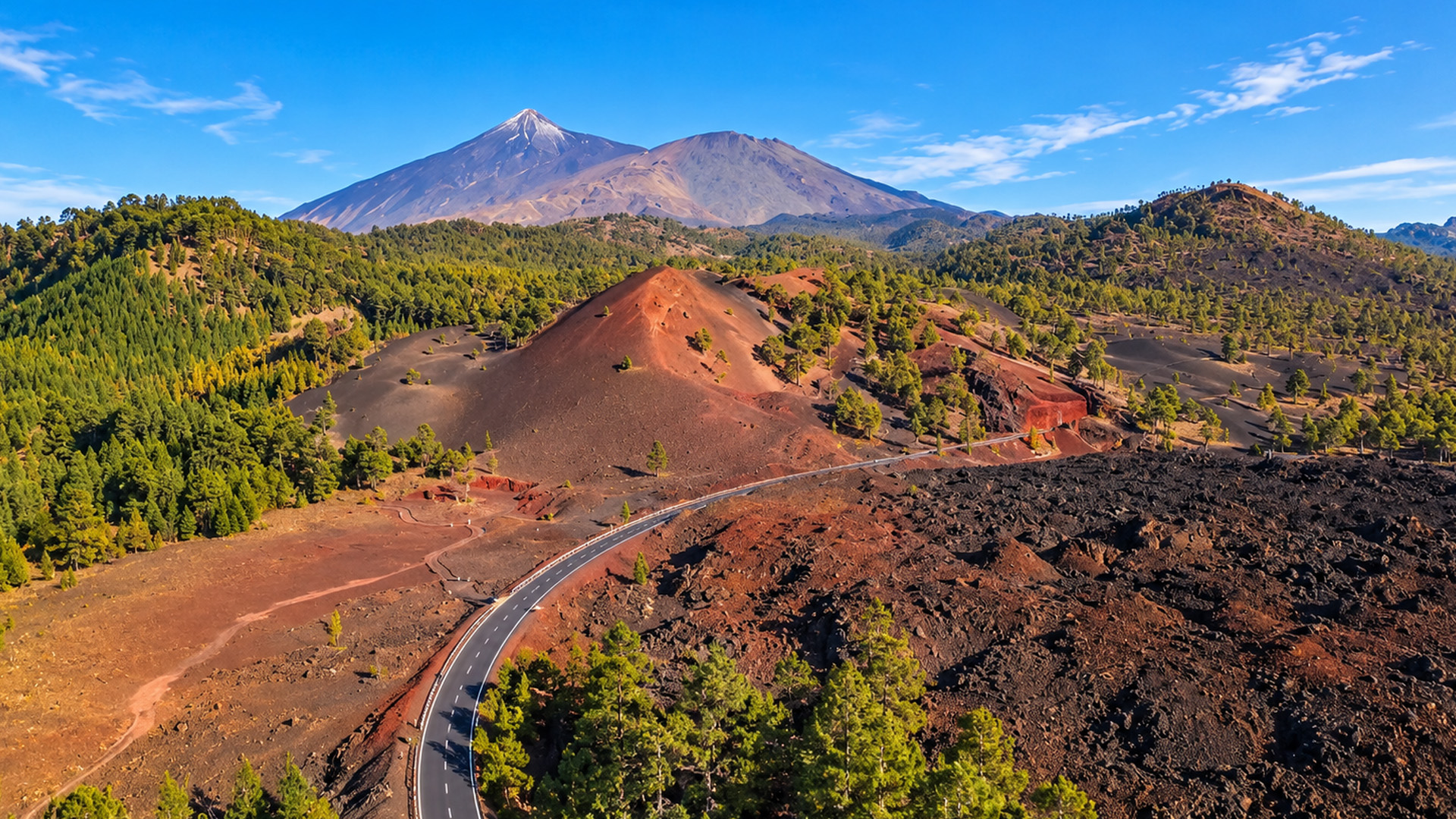 A road crossing an old volcanic landscape