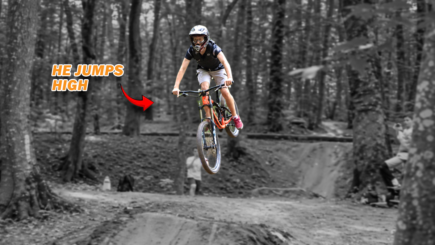 Bike rider performs a controlled stunt jump