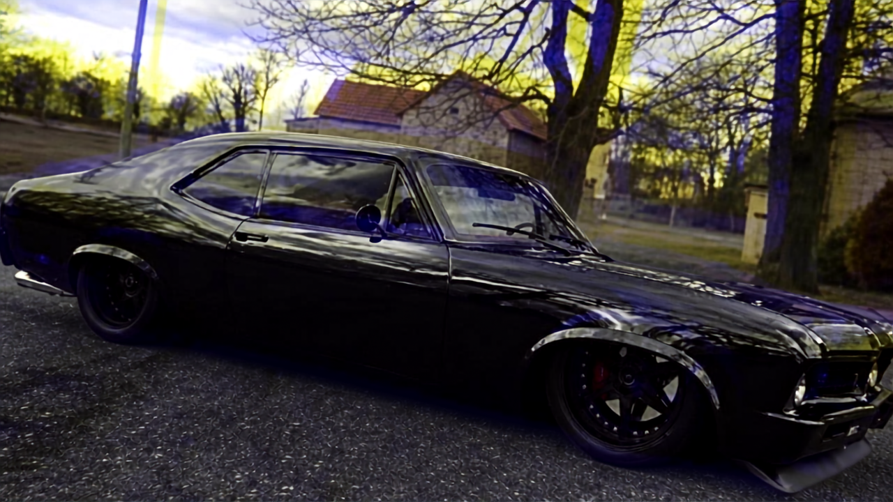 Custom black Chevy Nova with a slammed design