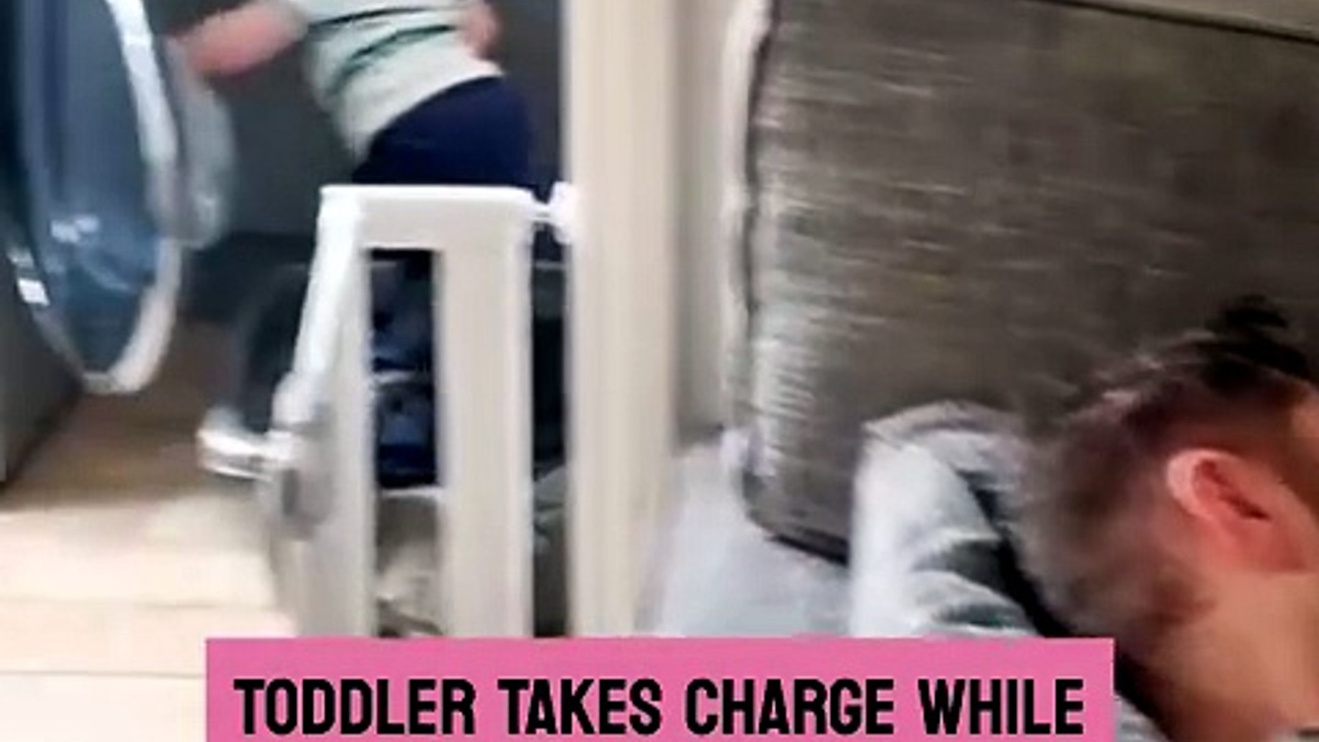 Toddler gets busy with the laundry while dad is fast asleep