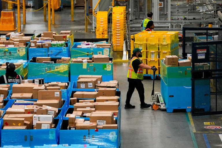 Amazon raises starting pay $1 and gives workers 10% grocery discount
