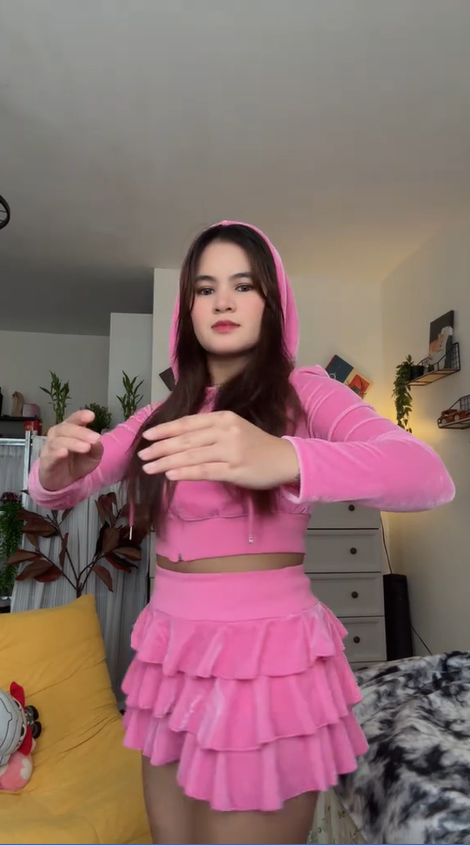 Doll dance trend in a fun pink outfit performance