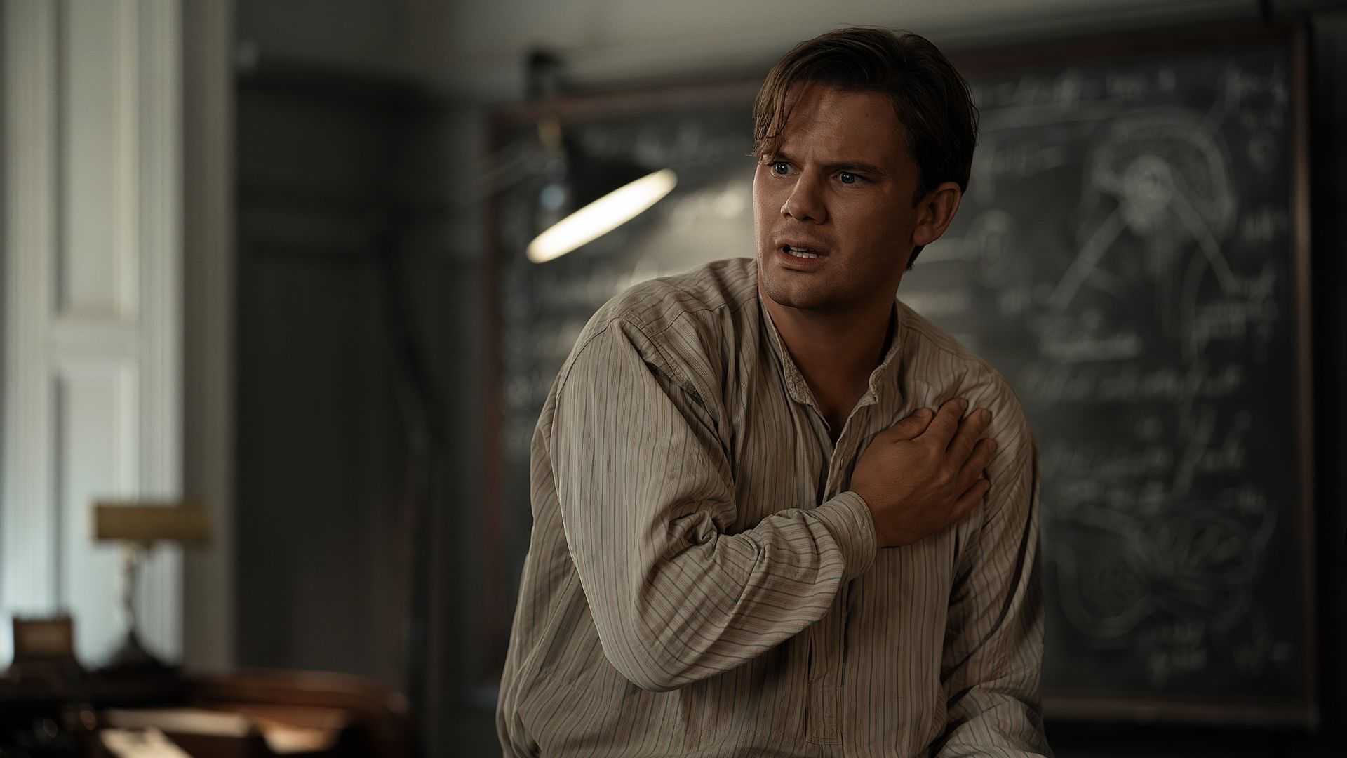 Henry holding his shoulder looking confused in Outlander: Blood of My Blood