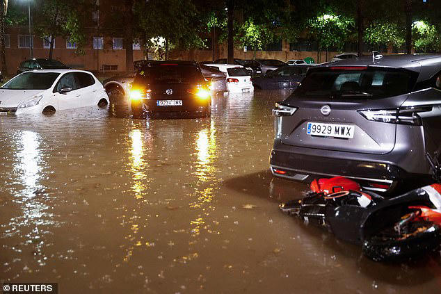 Streets are submerged by floods in Spain following country's hottest ...