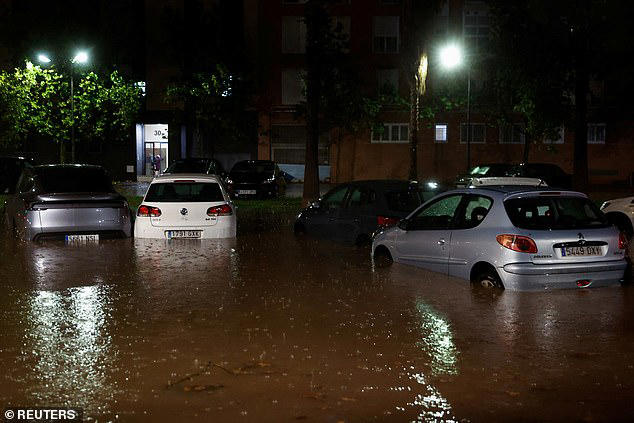 Streets are submerged by floods in Spain following country's hottest ...