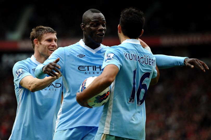 James Milner celebrates with Mario Balotelli and Sergio Aguero during Manchester City's 6-1 win over Manchester United in 2011