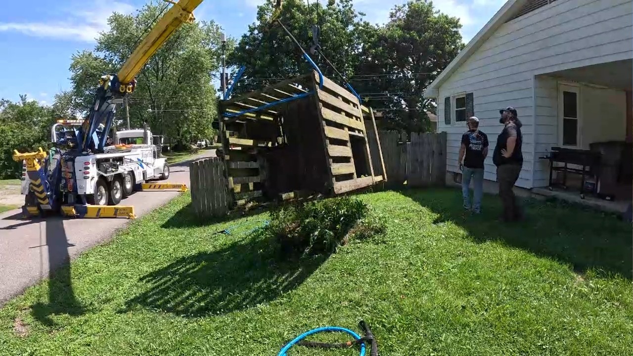 A heavy-duty rotator takes on a playhouse