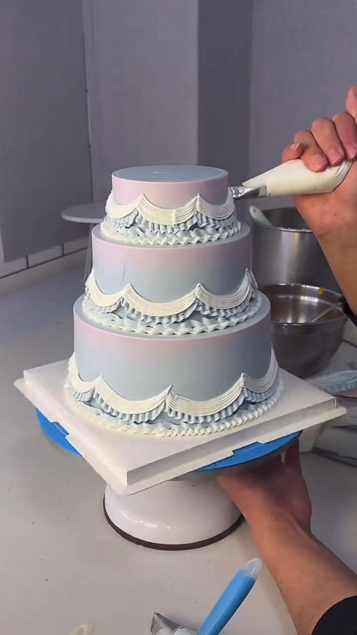 Elegant pastel tiered cake gets a stunning vintage piped finish