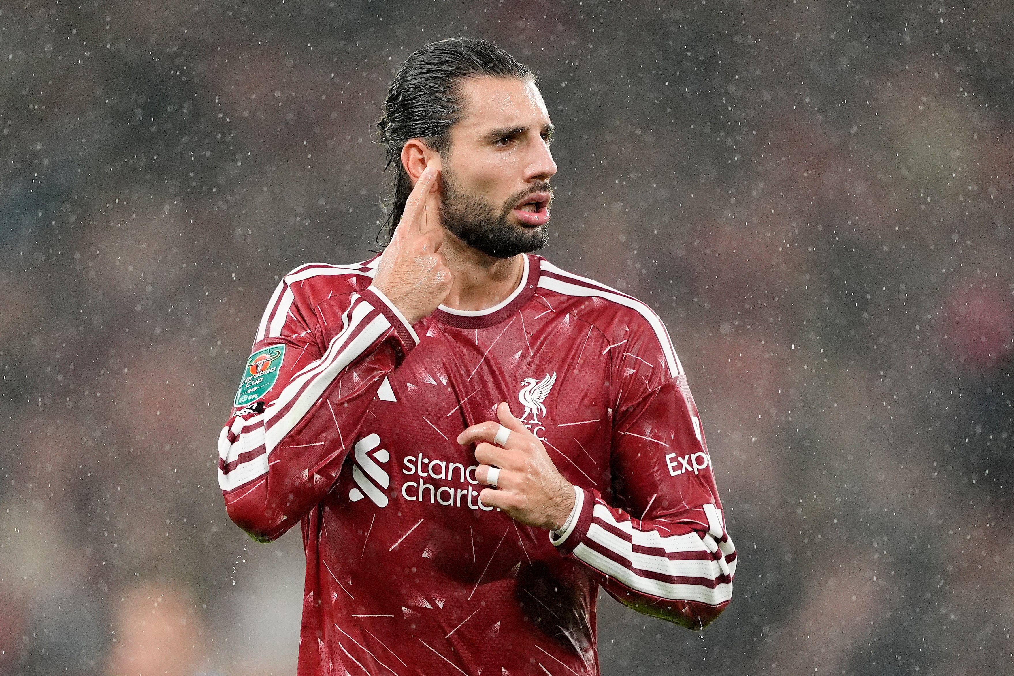 Szoboszlai pointed to his ear during his celebration of a goal against Spurs (PA)