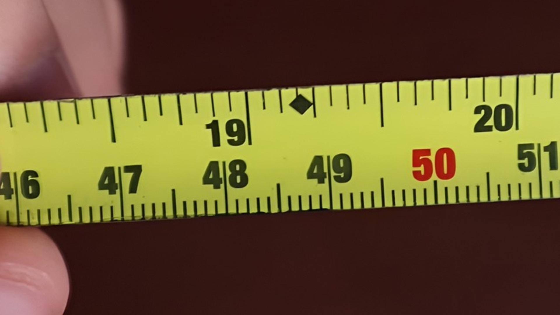 Here's what those black diamonds on tape measures are for