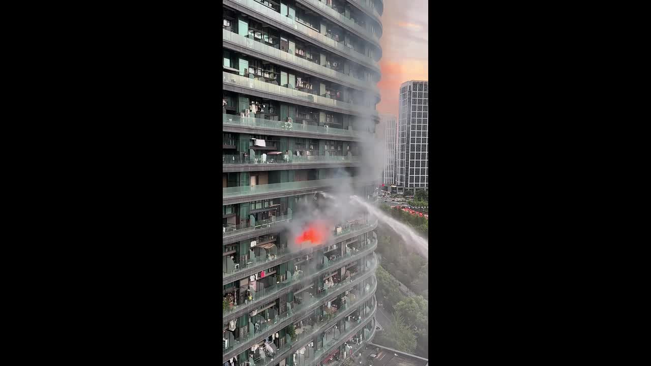 Firefighters battle high-rise residential building fire in Hangzhou ...